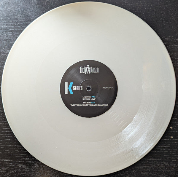 K Series* : Give Me Love / Everybody's Got To Learn Sometimes (12", Ltd, Whi)
